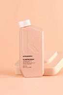 Kevin Murphy Plumping Wash bottle on a peach background - Hair Care Canada