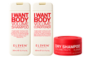 A three-piece haircare set from Eleven Australia, including two tall bottles of 'I Want Body Volume Shampoo' and 'I Want Body Volume Conditioner' and one red jar of 'Dry Shampoo Volume Paste'.