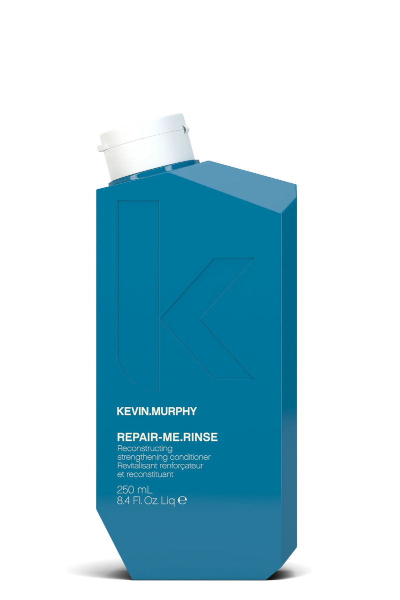 Blue bottle of Kevin Murphy Repair Me Rinse on a white background - Hair Care Canada