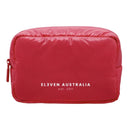 A red puffer-style toiletry bag with white text reading 'ELEVEN AUSTRALIA est. 2011' on the front, shown on a plain white background.