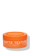 Orange jar of matte texture styling paste on a white background - Hair Care Canada