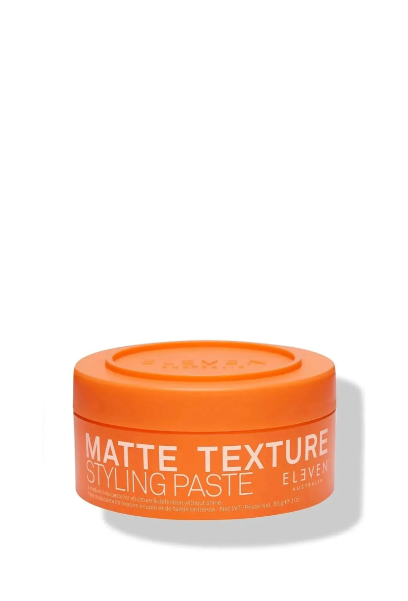 Orange jar of matte texture styling paste on a white background - Hair Care Canada