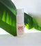 Elven Naturals 'I Want Body Volume Powder' bottle with green leaves in the background - Hair Care Canada