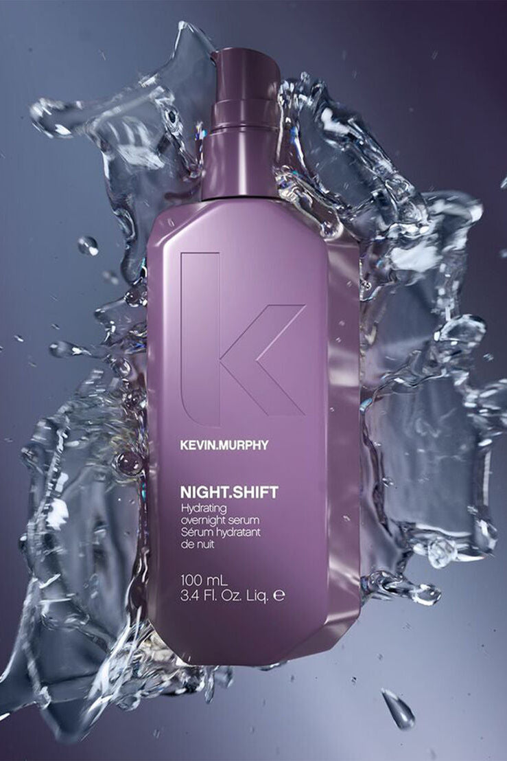 Kevin Murphy Night Shift serum bottle surrounded by water splashes on a dark background - Hair Care Canada