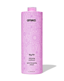 Pink bottle of amika 'big hit' volumizing conditioner on a white background - Hair Care Canada
