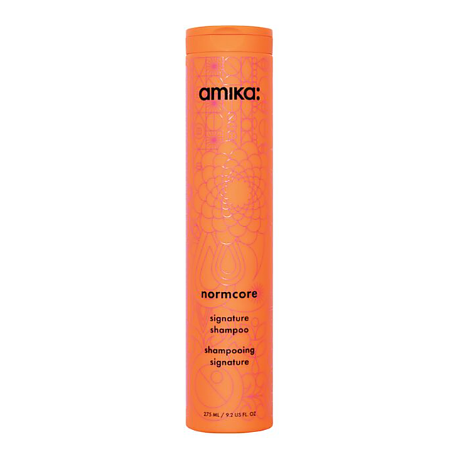Amika Normcore signature shampoo bottle on a white background - Hair Care Canada