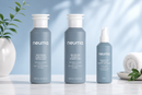 Three Neuma hair care products on a white surface with a light blue background - Hair Care Canada