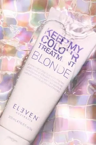 Bottle of 'Keep My Colour Treatments' by Eleven Australia on a colorful, reflective background - Hair Care Canada