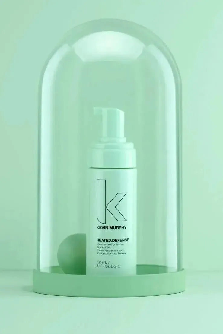 Kevin Murphy hair product under a glass dome on a light green background - Hair Care Canada 