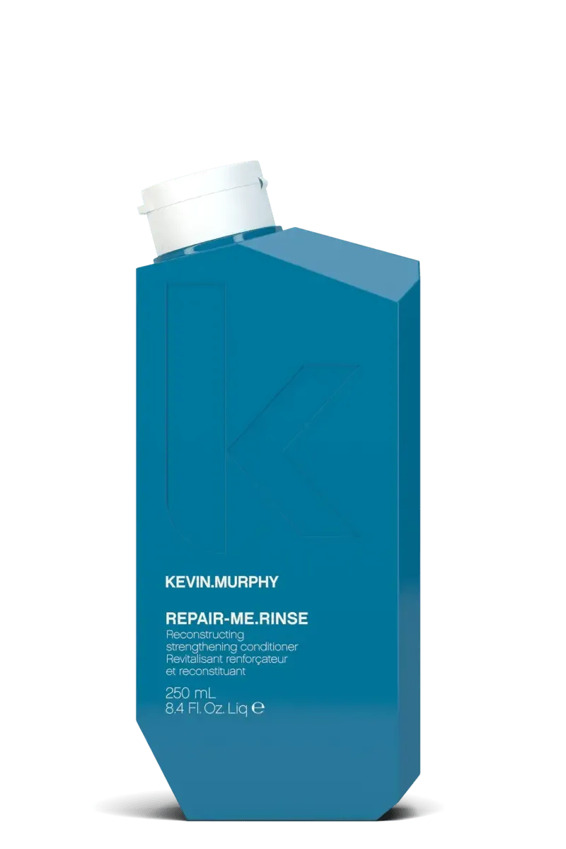Blue bottle of Kevin Murphy Repair Me Rinse on a white background - Hair Care Canada